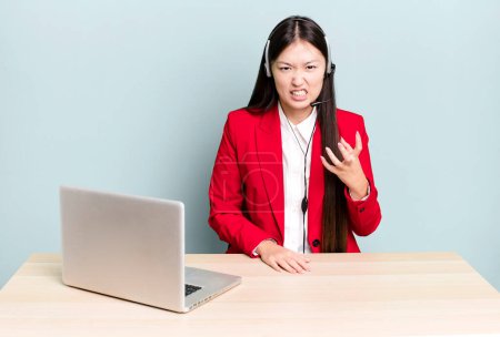 Photo for Pretty asian woman looking angry, annoyed and frustrated. business desk concept - Royalty Free Image