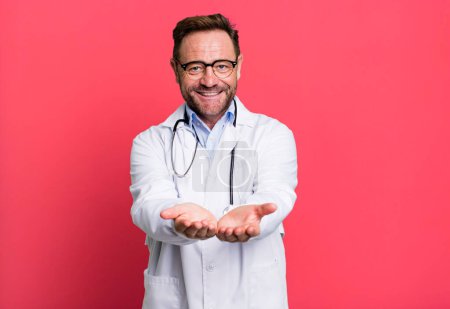 Photo for Middle age man smiling happily with friendly and  offering and showing a concept. physician concept - Royalty Free Image