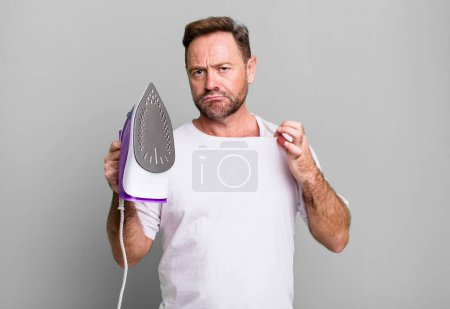 Photo for Middle age man looking arrogant, successful, positive and proud. housekeeper concept - Royalty Free Image