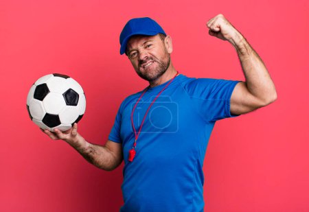 Photo for Middle age man sport coach concept with a soccer ball - Royalty Free Image