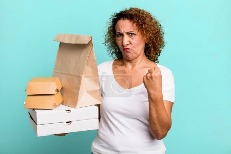 Photo for Feeling angry, annoyed, rebellious and aggressive. take away fast food delivery concept. - Royalty Free Image