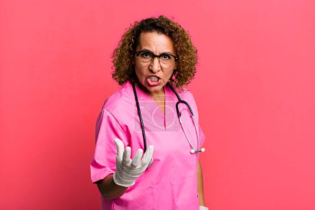 Photo for Pretty middle age woman looking angry, annoyed and frustrated. nurse concept - Royalty Free Image