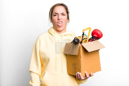 Photo for Pretty blonde woman feeling disgusted and irritated and tongue out. tool box and repair concept - Royalty Free Image