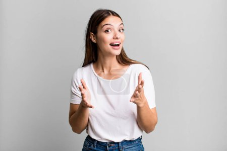 Téléchargez les photos : Pretty young adult woman feeling happy, astonished, lucky and surprised, like saying omg seriously? Unbelievable - en image libre de droit