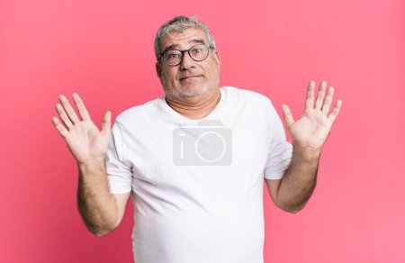 Photo for Middle age senior man looking nervous, anxious and concerned, saying not my fault or I didnt do it - Royalty Free Image