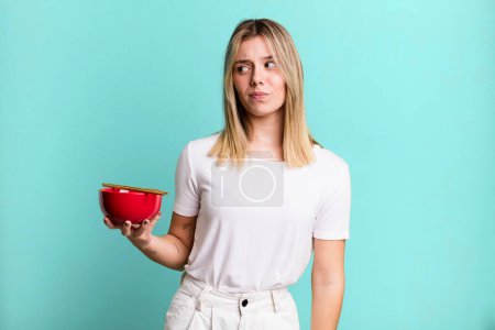 Photo for Young pretty woman feeling sad, upset or angry and looking to the side. japanese ramen noodles concept - Royalty Free Image