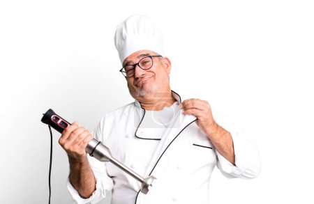 middle age senior man looking arrogant, successful, positive and proud. restaurant chef with a tool concept