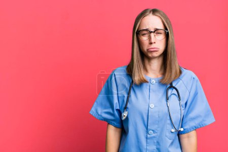 Photo for Feeling sad and whiney with an unhappy look and crying. nurse concept - Royalty Free Image