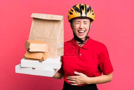 Téléchargez les photos : Laughing out loud at some hilarious joke. fast food delivery or take away - en image libre de droit