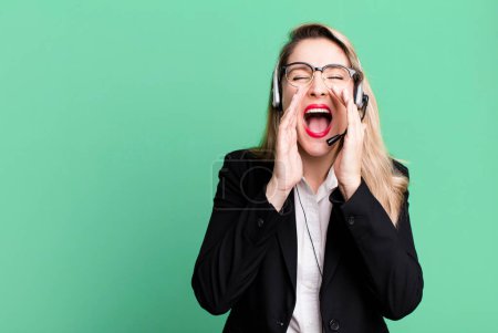 Photo for Feeling happy,giving a big shout out with hands next to mouth. telemarketer concept - Royalty Free Image