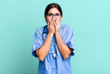 Photo for Covering mouth with hands with a shocked. nurse concept - Royalty Free Image