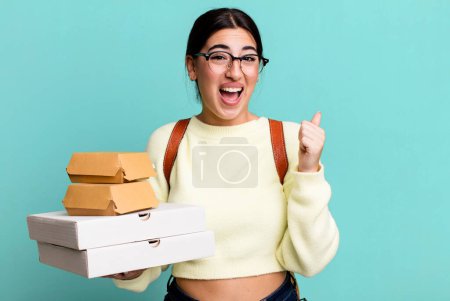 Photo for Feeling shocked,laughing and celebrating success. fast food delivery or take away - Royalty Free Image