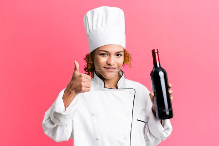 Photo for Red hair pretty chef woman holding a wine bottle - Royalty Free Image