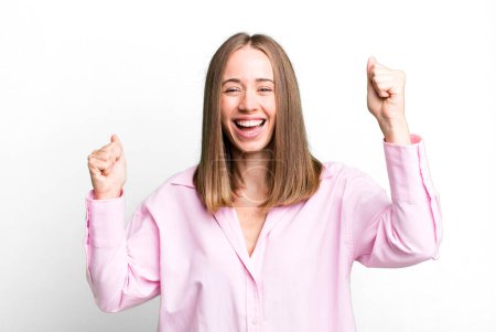 Photo for Shouting triumphantly, looking like excited, happy and surprised winner, celebrating - Royalty Free Image