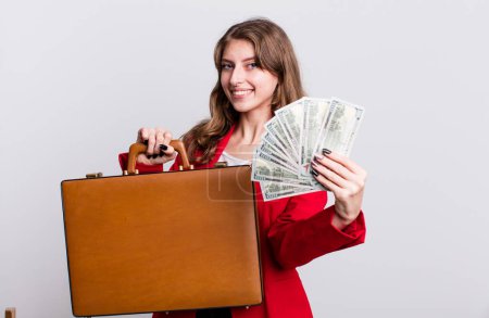 Photo for Pretty businesswoman with bills and a suitcase - Royalty Free Image