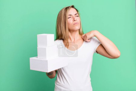 Photo for Pretty blonde woman feeling stressed, anxious, tired and frustrated. set of different packagings - Royalty Free Image