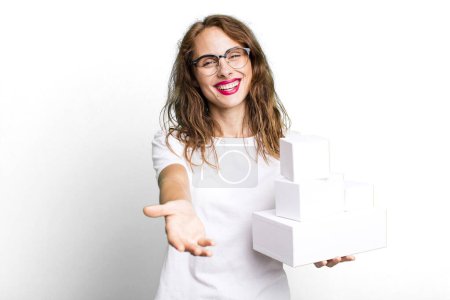 Photo for Hispanic pretty woman smiling happily with friendly and  offering and showing a concept. with white boxes packages - Royalty Free Image