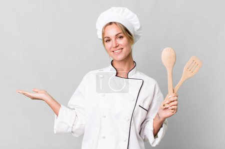 Photo for Pretty caucasian restaurant chef woman with wooden tool - Royalty Free Image