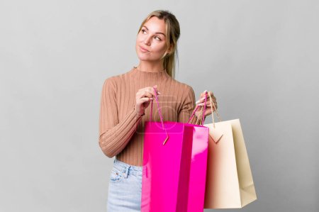 Photo for Pretty caucasian woman with shopping bags - Royalty Free Image