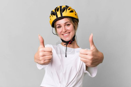 Photo for Pretty caucasian woman with a bycicle helmet - Royalty Free Image