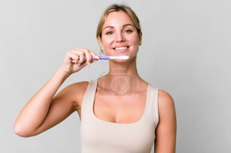 Photo for Pretty caucasian woman with a toothbrush - Royalty Free Image