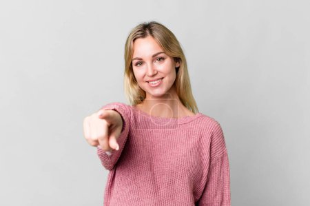 Photo for Caucasian blonde woman pointing at camera choosing you - Royalty Free Image