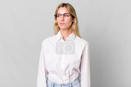 Photo for Caucasian blonde woman feeling sad, upset or angry and looking to the side - Royalty Free Image