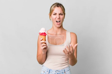 Téléchargez les photos : Caucasian blonde woman looking angry, annoyed and frustrated. ice cream concept - en image libre de droit