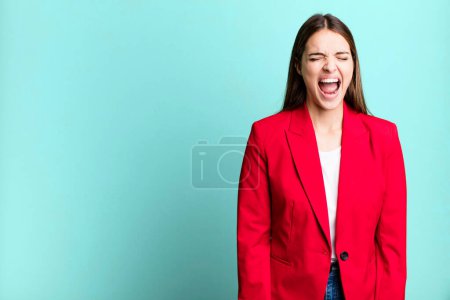 Photo for Young pretty woman shouting aggressively, looking very angry. businesswoman concept - Royalty Free Image