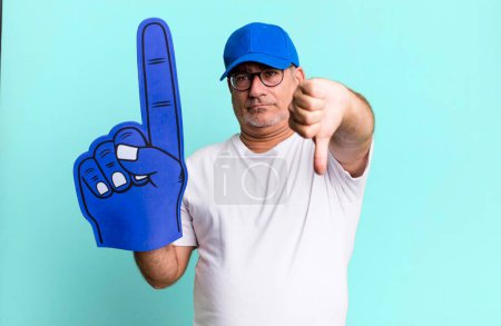 Photo for Middle age senior man feeling cross,showing thumbs down. number one fan concept - Royalty Free Image