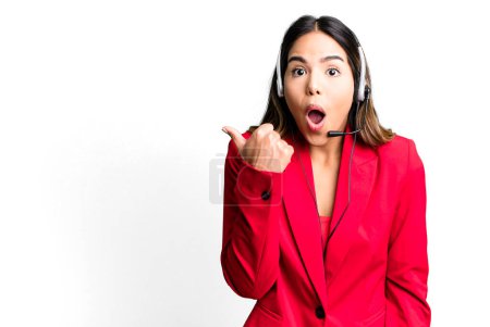 Photo for Hispanic pretty woman looking astonished in disbelief. telemarketing concept - Royalty Free Image