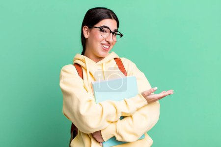 Photo for Smiling cheerfully, feeling happy and showing a concept. university student concept - Royalty Free Image