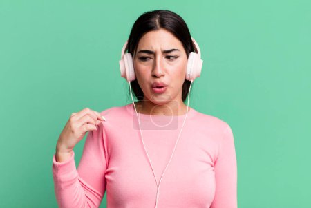 Photo for Feeling stressed, anxious, tired and frustrated. listening music with headphones - Royalty Free Image