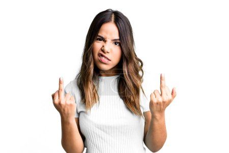 Photo for Hispanic pretty woman feeling provocative, aggressive and obscene, flipping the middle finger, with a rebellious attitude - Royalty Free Image