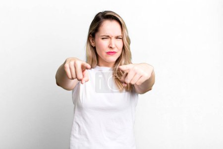 Photo for Pointing forward at camera with both fingers and angry expression, telling you to do your duty - Royalty Free Image