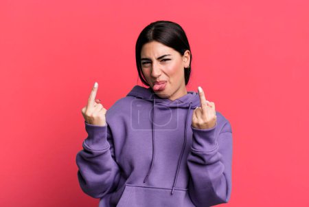 Photo for Feeling provocative, aggressive and obscene, flipping the middle finger, with a rebellious attitude - Royalty Free Image