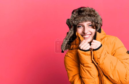 Téléchargez les photos : Caucasian pretty blonde woman wearing anorak and hat. winter and cold concept - en image libre de droit