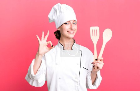 Photo for Caucasian pretty blonde woman. chef concept with wooden tools - Royalty Free Image