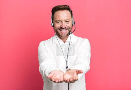 Photo for Middle age man smiling happily with friendly and  offering and showing a concept. telemarketer concept - Royalty Free Image