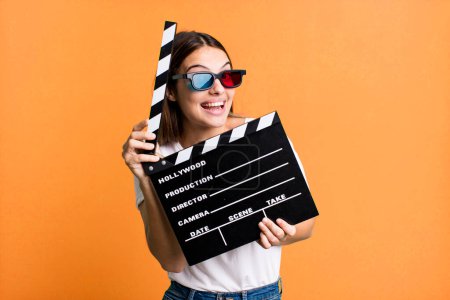 Photo for Young pretty woman with a cinema clapper. film or movie concept - Royalty Free Image
