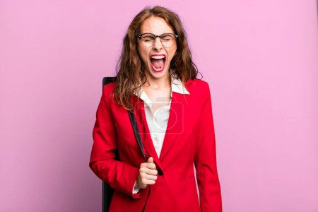 Photo for Hispanic pretty woman shouting aggressively, looking very angry. architect or business concept - Royalty Free Image
