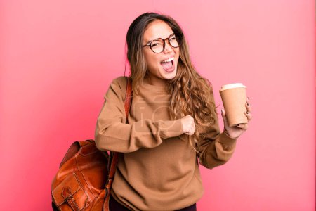 Photo for Hispanic pretty woman feeling happy and facing a challenge or celebrating. take away coffee concept - Royalty Free Image