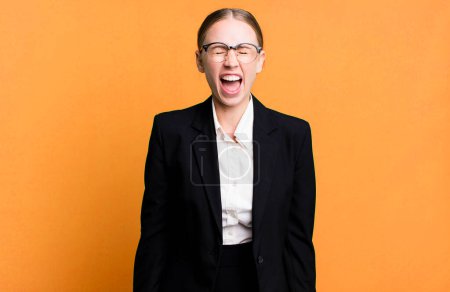 Photo for Caucasian pretty woman shouting aggressively, looking very angry. business concept - Royalty Free Image