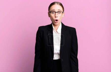 Photo for Caucasian pretty woman looking very shocked or surprised. business concept - Royalty Free Image