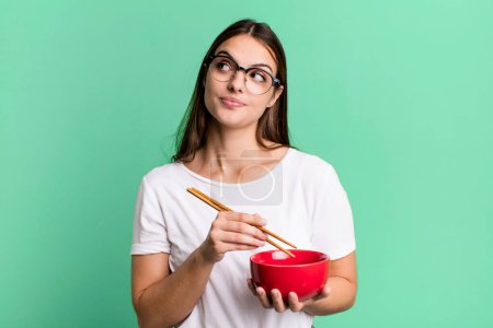 Photo for Young pretty woman with a japanese noodles ramen bolw - Royalty Free Image