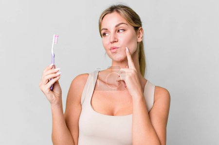 Photo for Pretty caucasian woman with a toothbrush - Royalty Free Image