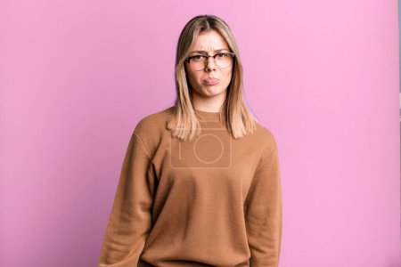 Photo for Blonde pretty woman feeling sad and whiney with an unhappy look, crying with a negative and frustrated attitude - Royalty Free Image