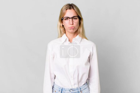 Photo for Caucasian blonde woman feeling sad and whiney with an unhappy look and crying - Royalty Free Image