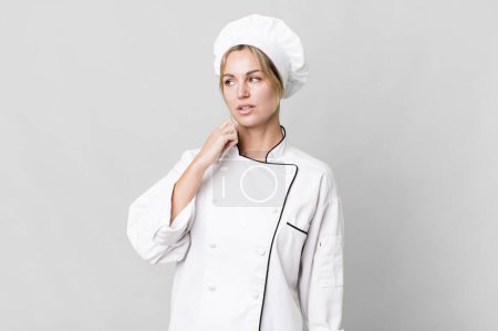 Photo for Caucasian blonde woman feeling stressed, anxious, tired and frustrated. chef concept - Royalty Free Image