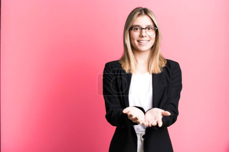 Photo for Young pretty woman smiling happily with friendly and  offering and showing a concept. business concept - Royalty Free Image